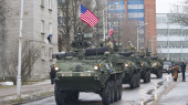 U.S. military vehicles paraded 300 yards from the Russian border